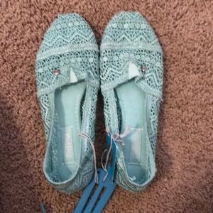 NWT turquoise slip ons size 7